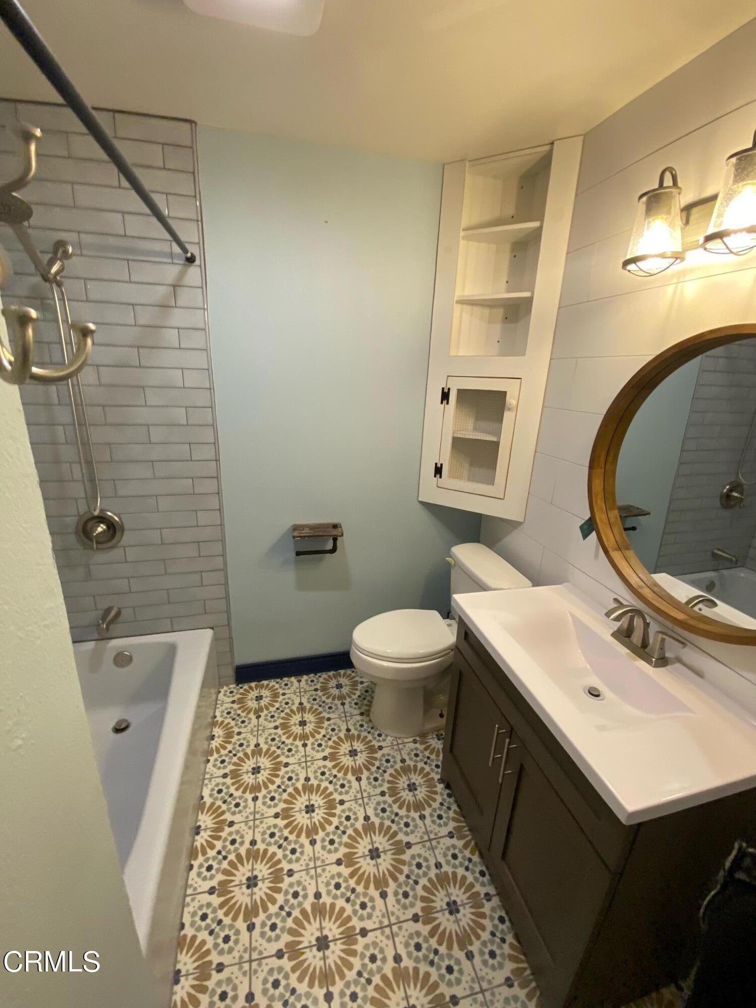 2046 Koala Way Ventura, CA 93003 - Photo 12 of 29 a bathroom with a sink a toilet and shower