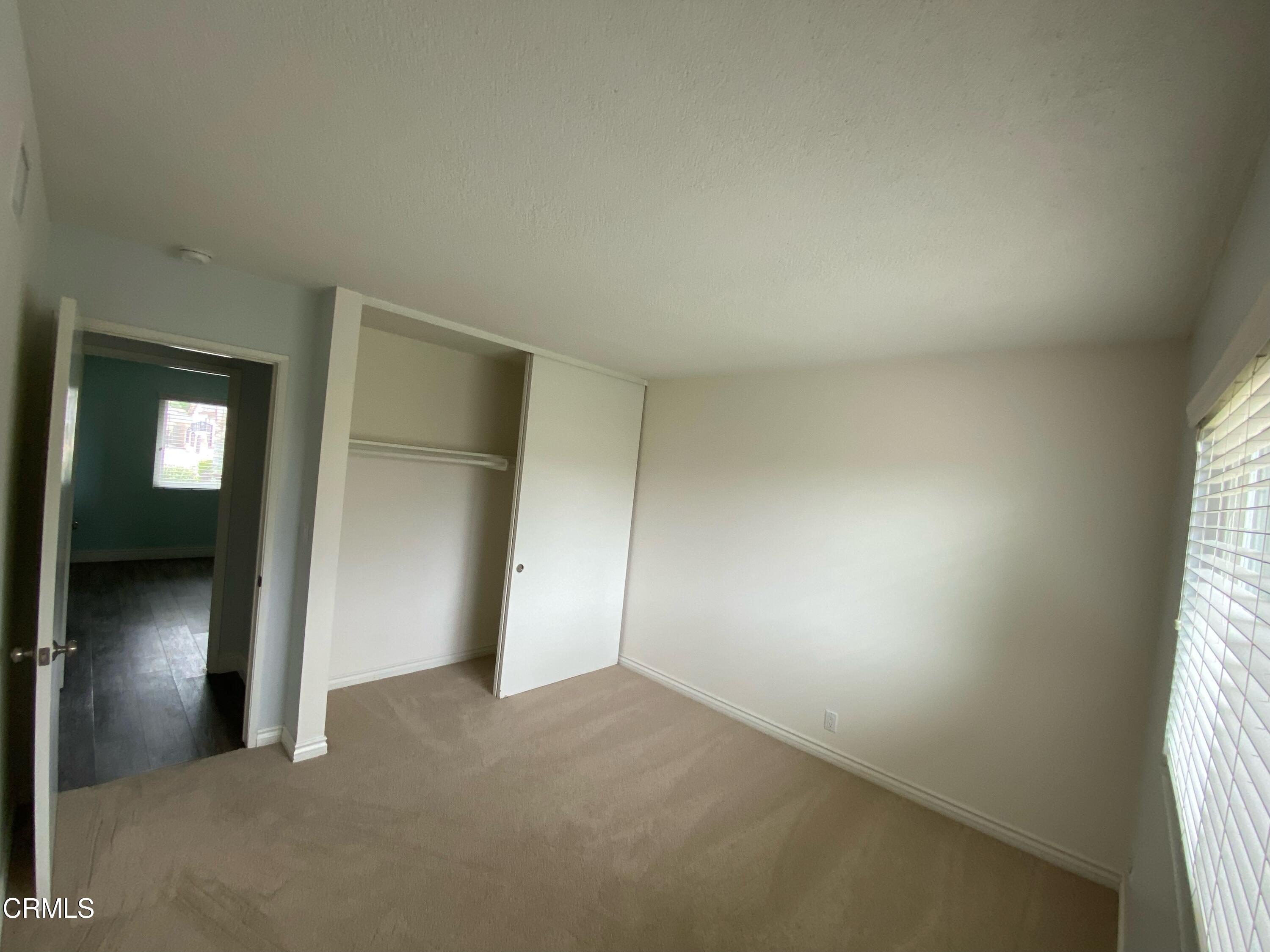 2046 Koala Way Ventura, CA 93003 - Photo 16 of 29 an empty room with windows and closet