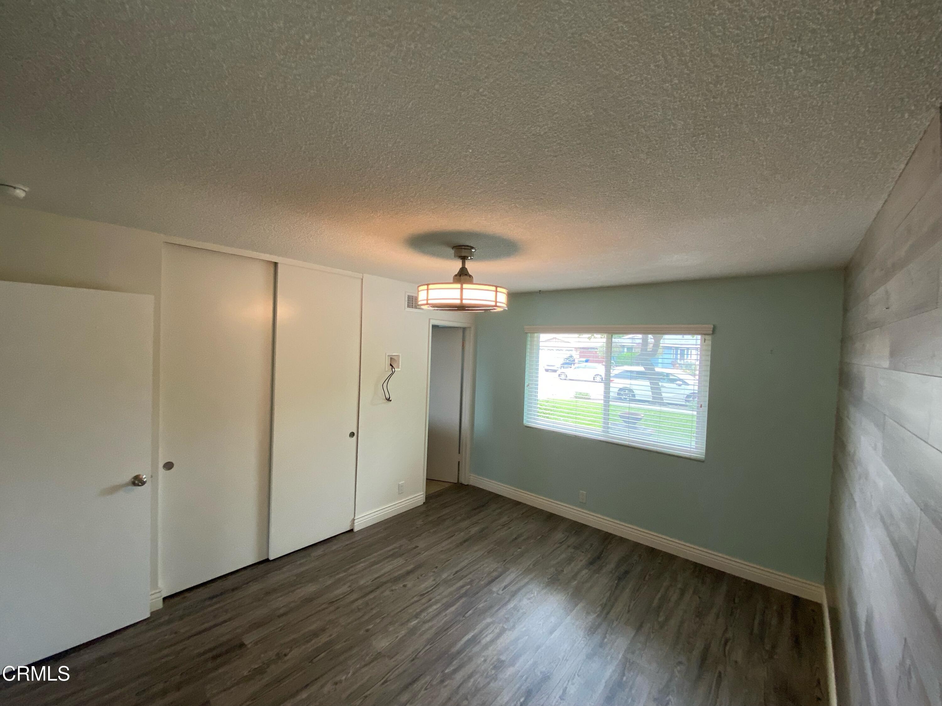 2046 Koala Way Ventura, CA 93003 - Photo 17 of 29 wooden floor in an empty room with a window