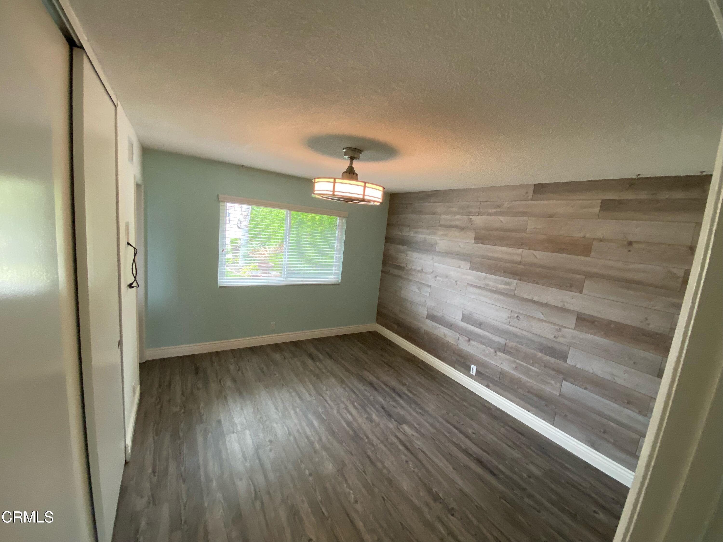 2046 Koala Way Ventura, CA 93003 - Photo 18 of 29 a view of room with window and wooden floor