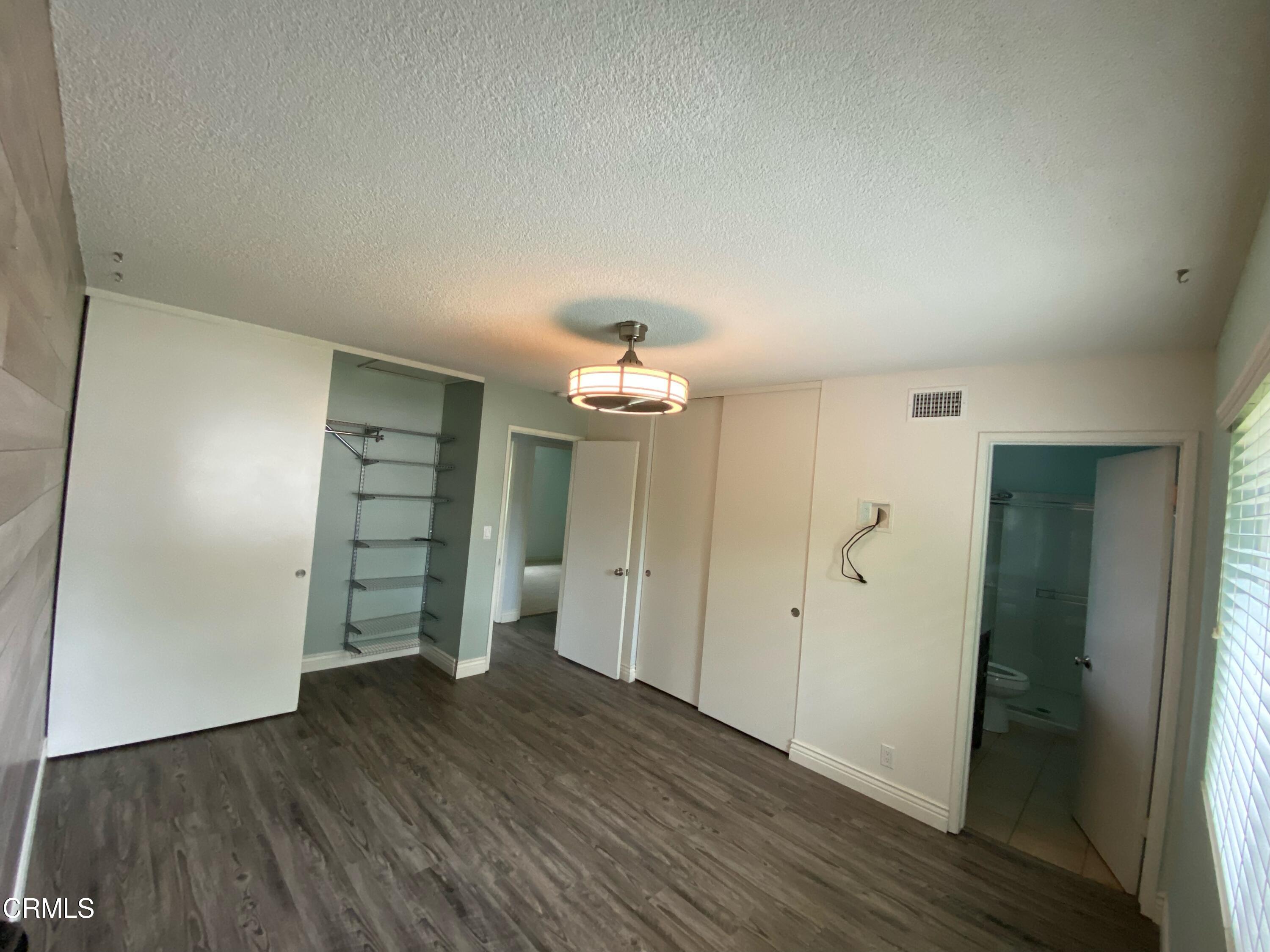 2046 Koala Way Ventura, CA 93003 - Photo 19 of 29 wooden floor in an empty room with a window