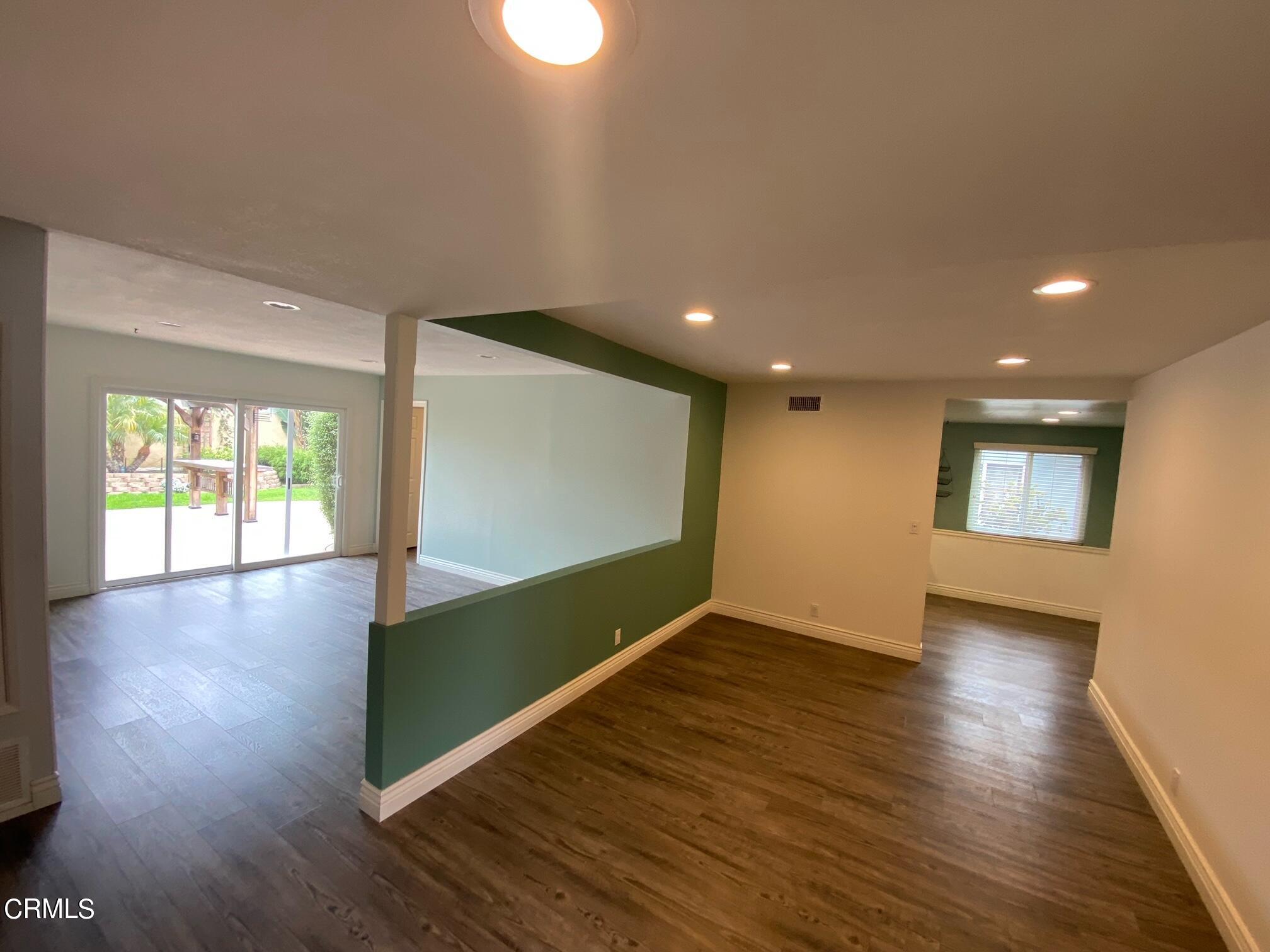 2046 Koala Way Ventura, CA 93003 - Photo 3 of 29 a view of room with wooden floor and window