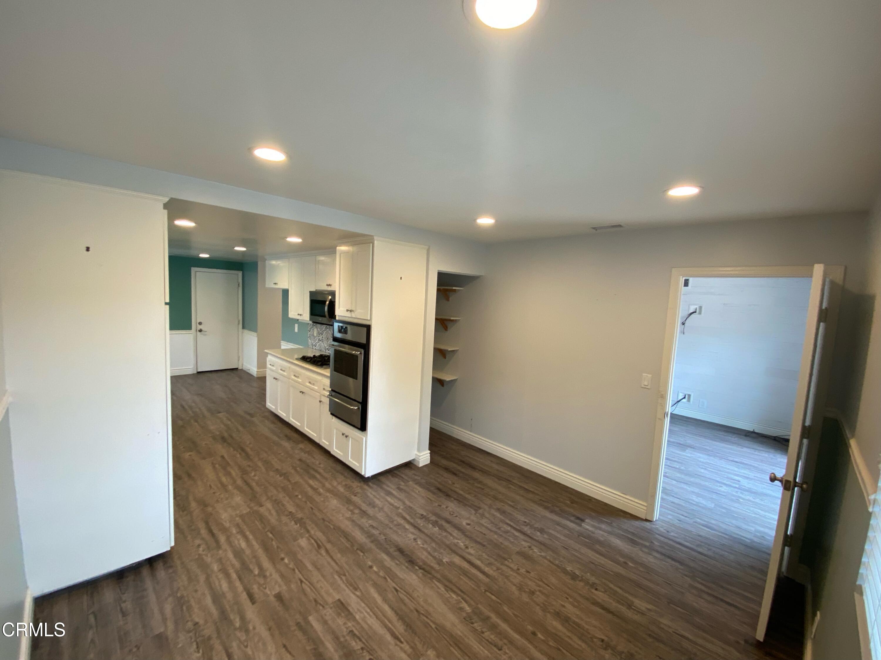2046 Koala Way Ventura, CA 93003 - Photo 6 of 29 a view of kitchen with cabinets and wooden floor
