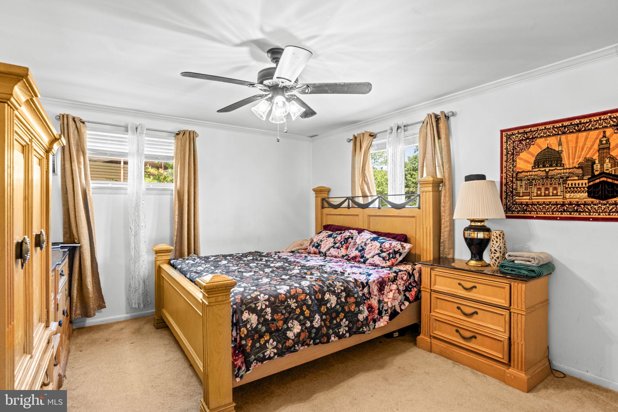3404 Ridgeway Road Harrisburg, PA 17109 - Photo 16 of 29 a bedroom with a bed and a chandelier