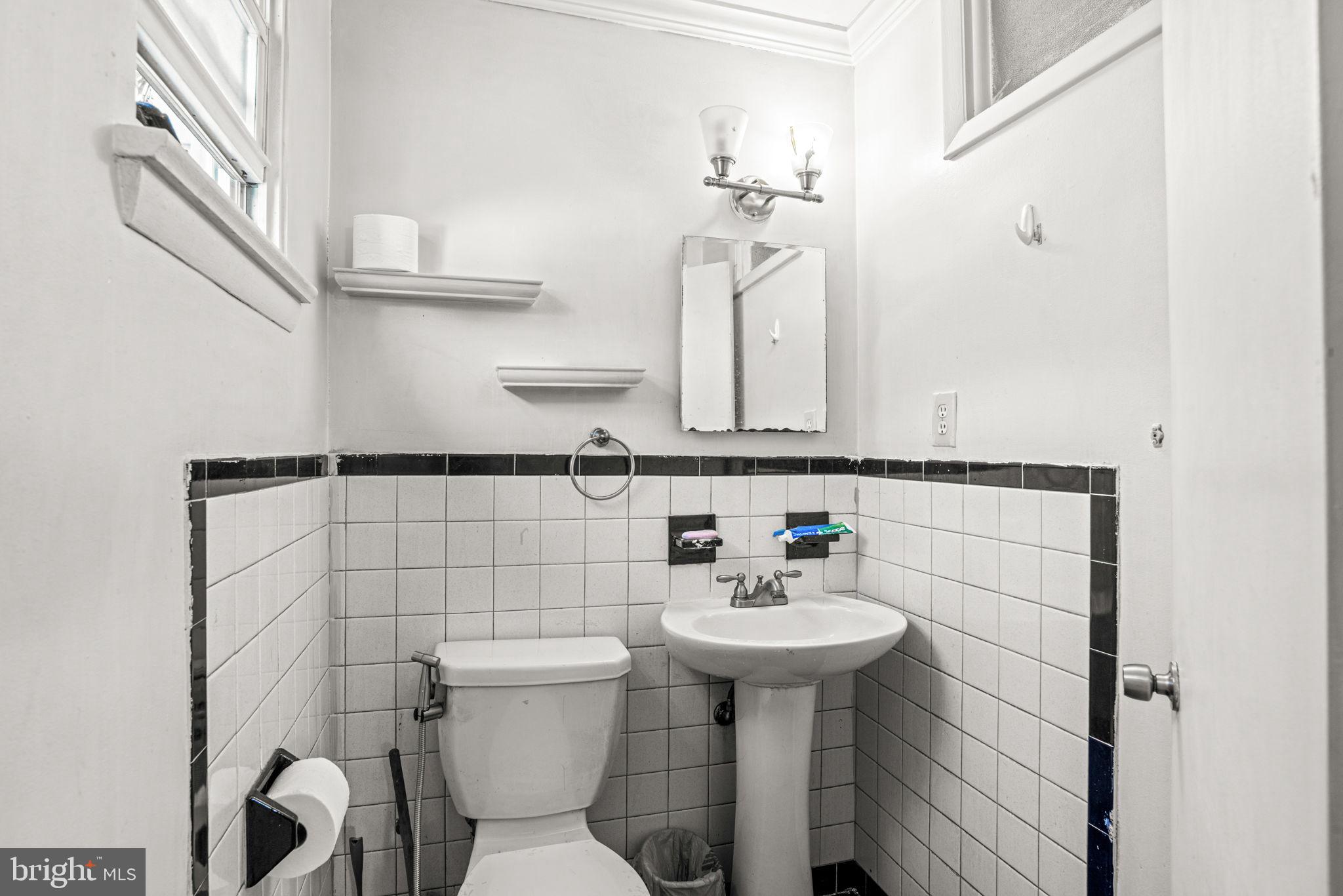 3404 Ridgeway Road Harrisburg, PA 17109 - Photo 19 of 29 a bathroom with a sink a toilet and mirror