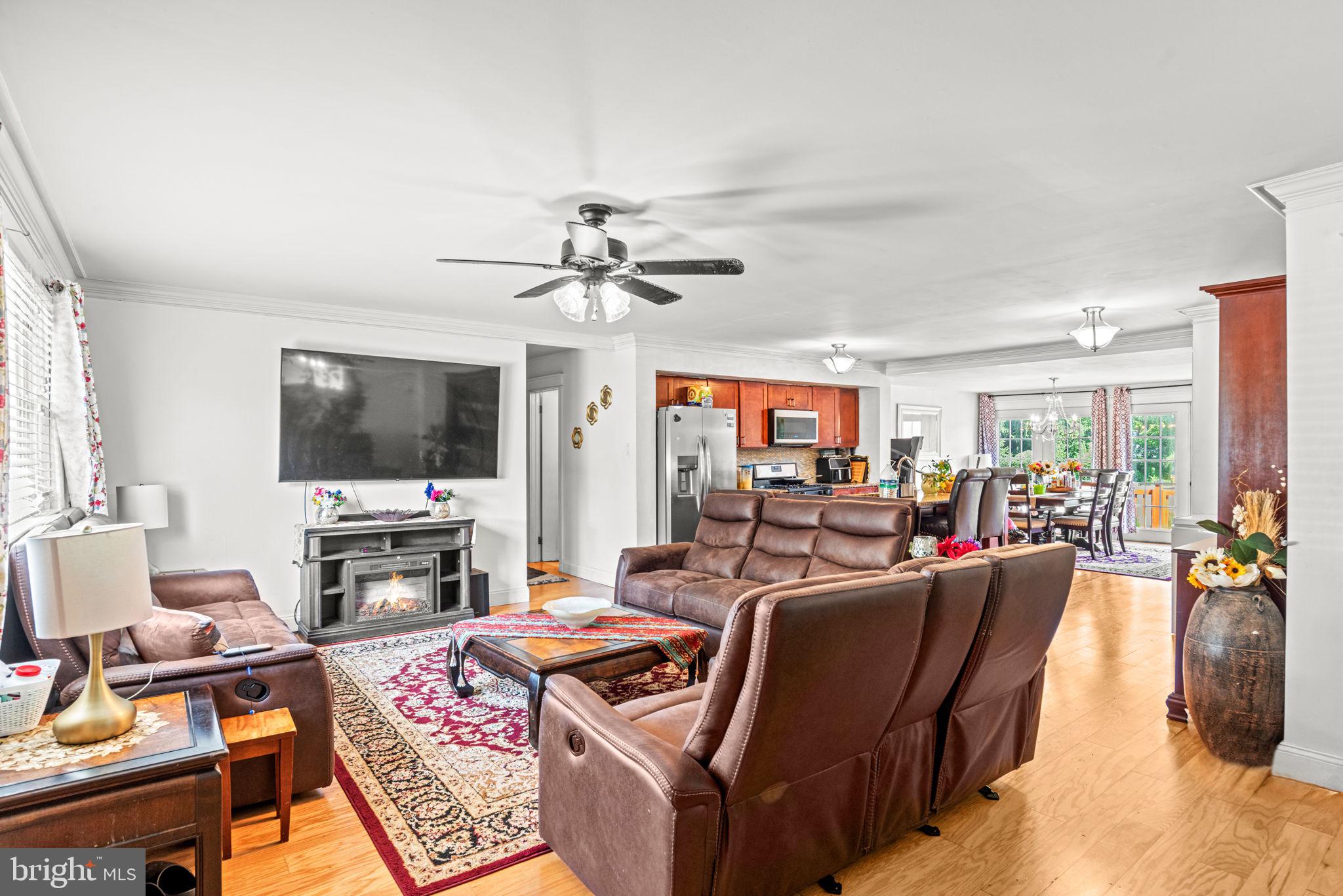 3404 Ridgeway Road Harrisburg, PA 17109 - Photo 5 of 29 a living room with furniture a flat screen tv and a large window