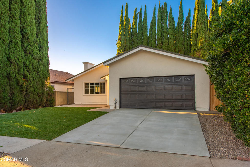 3497 Delilah Street Simi Valley, CA 93063 - Photo 3 of 26 a front view of house with yard and trees