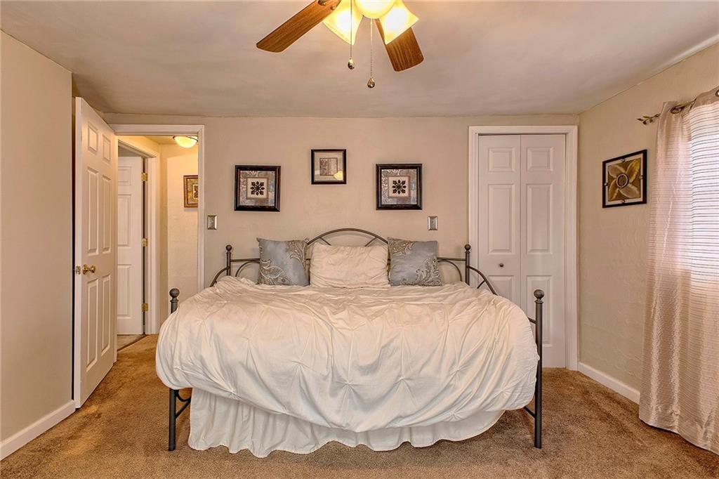 8002 Hayward Street Irwin, PA 15642 - Photo 20 of 31 a bedroom with a bed and a chandelier