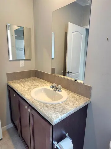 a swimming pool with outdoor seating and yard