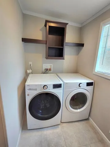 a view of a lake with a yard and palm trees