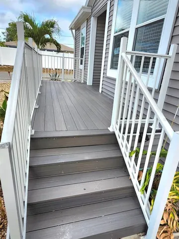a large kitchen with stainless steel appliances lots of counter space and a sink