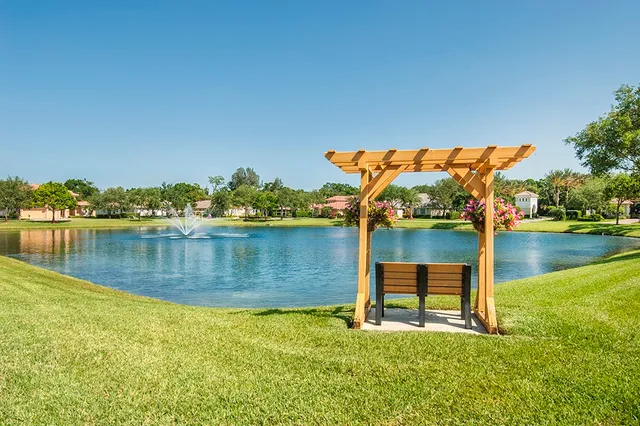 a view of a lake with a house in the background