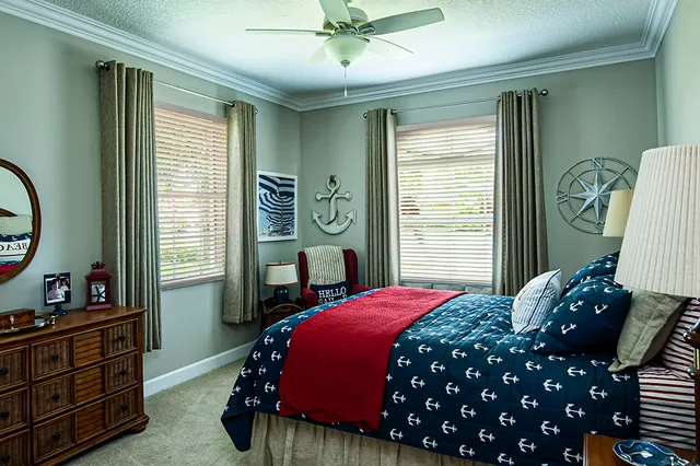 a bedroom with a bed and a dresser