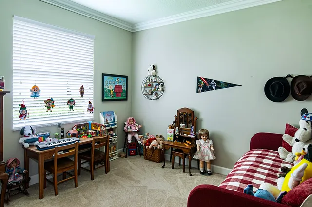 a bedroom with furniture and a chair