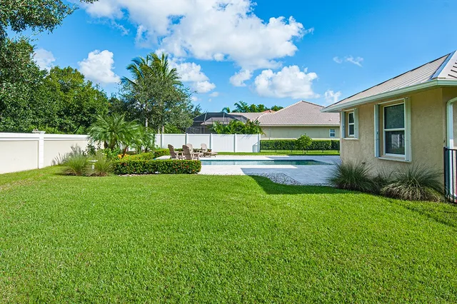 a view of a backyard with green space