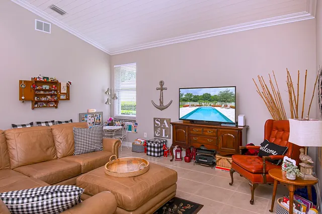 a living room with furniture a rug and a fireplace