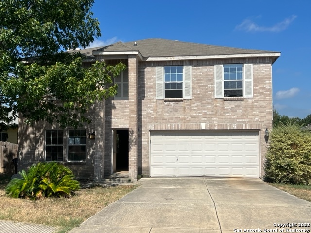 11127 Rindle Ranch San Antonio, TX 78249 - Photo 1 of 1 a front view of a house with garden