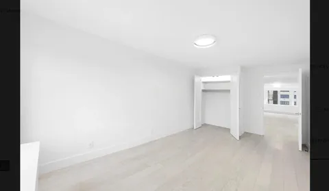a view of an empty room and closet