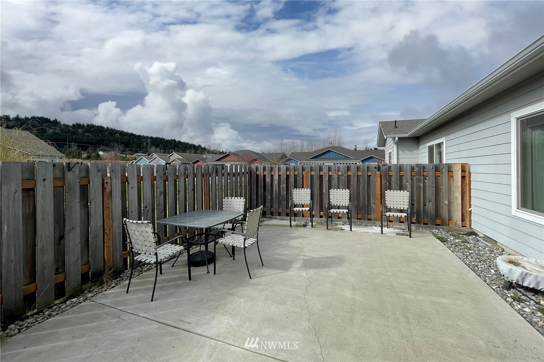 20 Stratus Loop Sequim, WA 98382 - Photo 11 of 40 a view of a dinning table and chairs in the patio