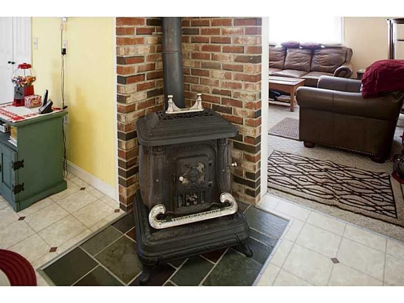 8 Old Hatchery Road Enfield, ME 04493 - Photo 11 of 32 Kitchen. Decorative wood stove in...