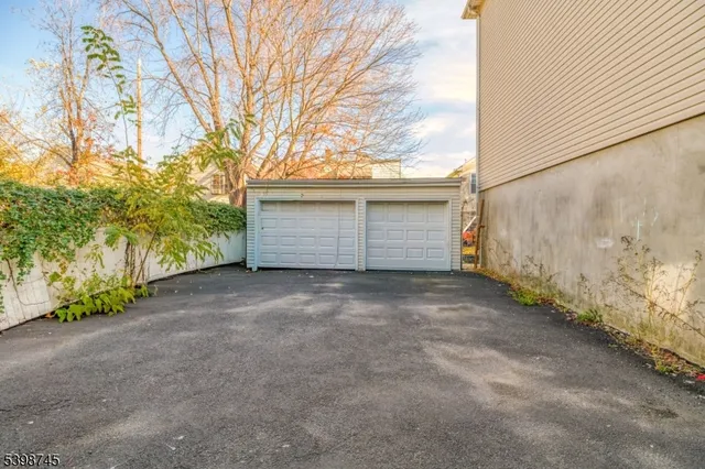 a view of backyard and garage