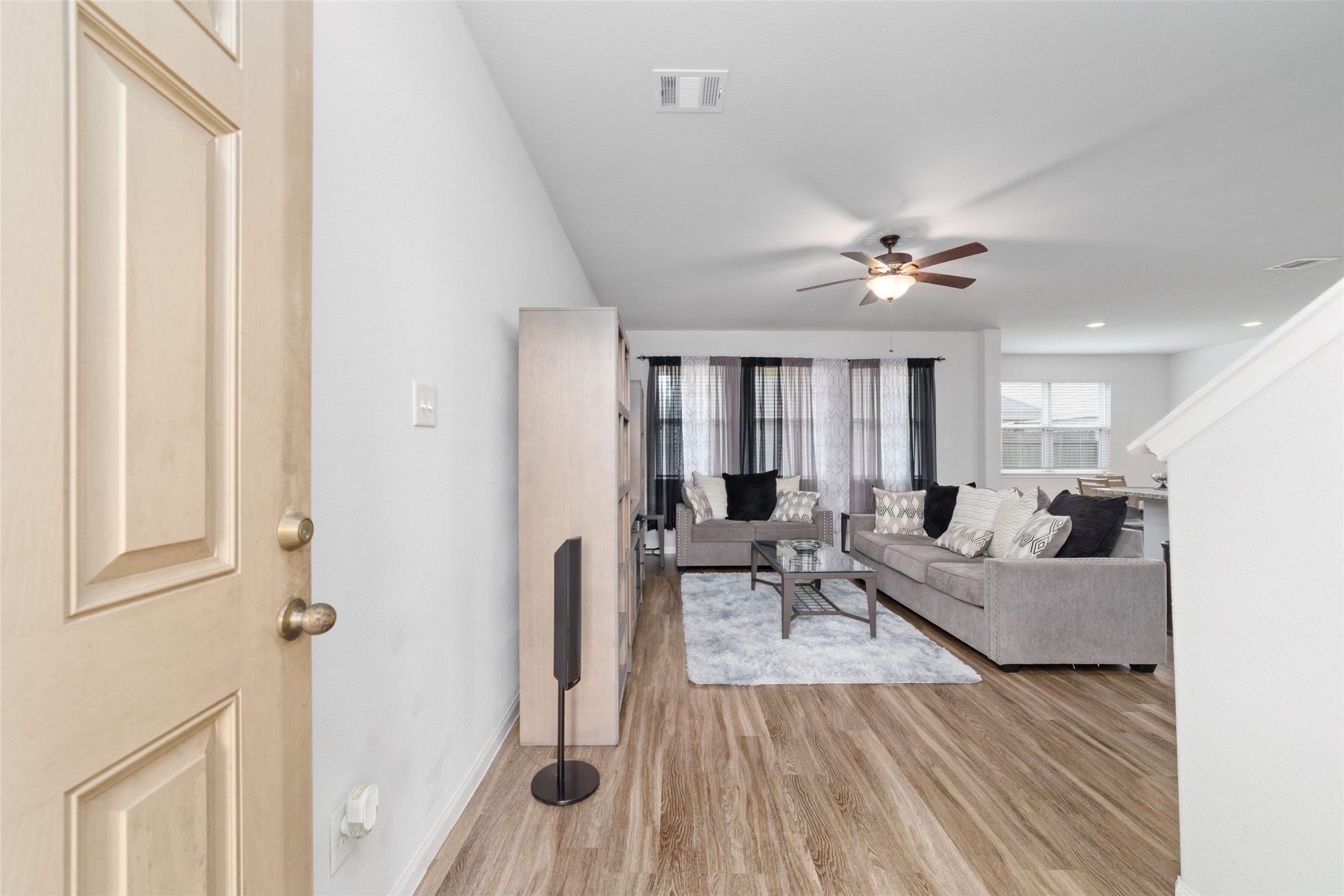 18619 Cooper Ravine Way Katy, TX 77449 - Photo 5 of 23 a living room with furniture and wooden floor