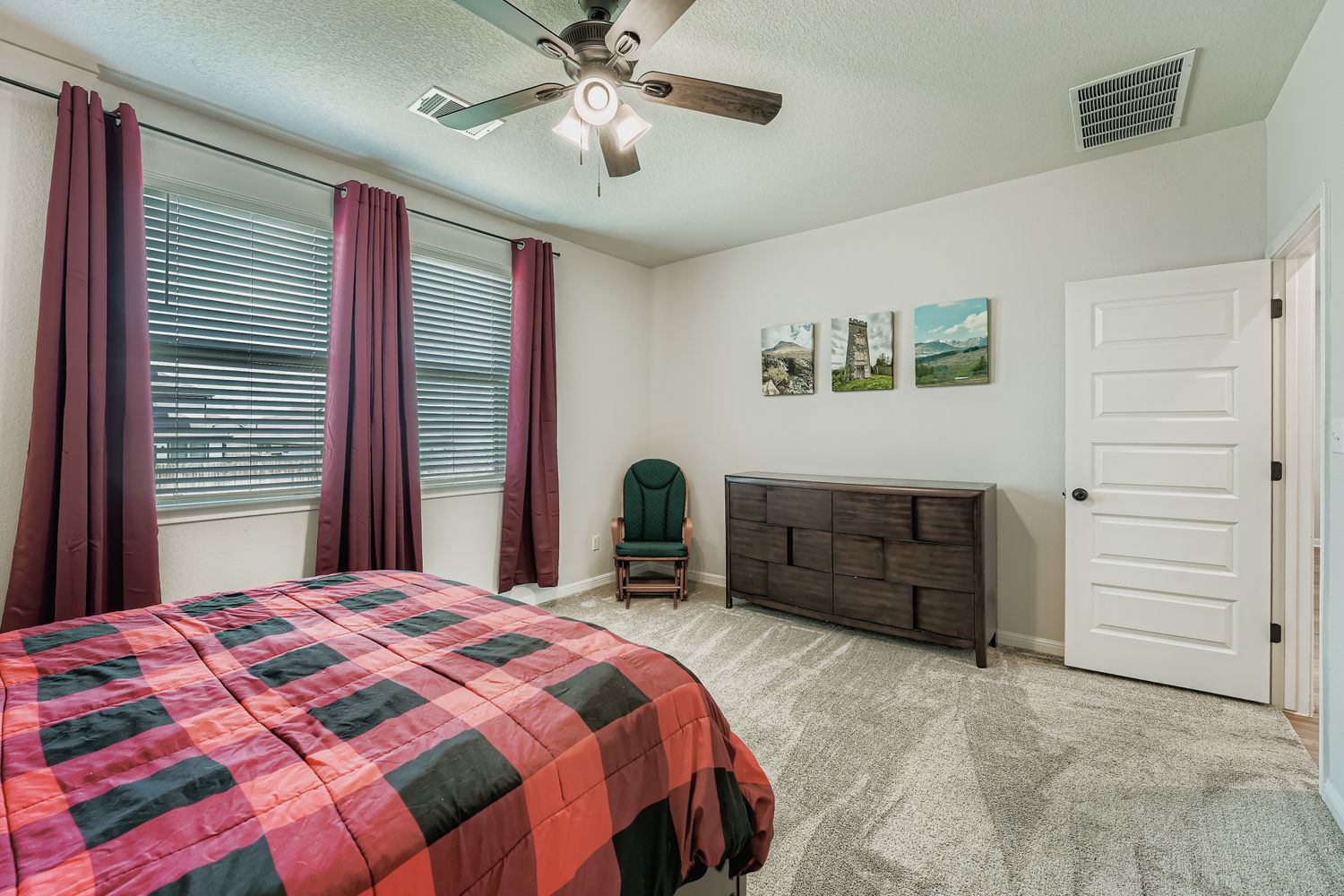 148 Gullivers Drive Elgin, TX 78621 - Photo 10 of 21 a bedroom with a bed and a chandelier