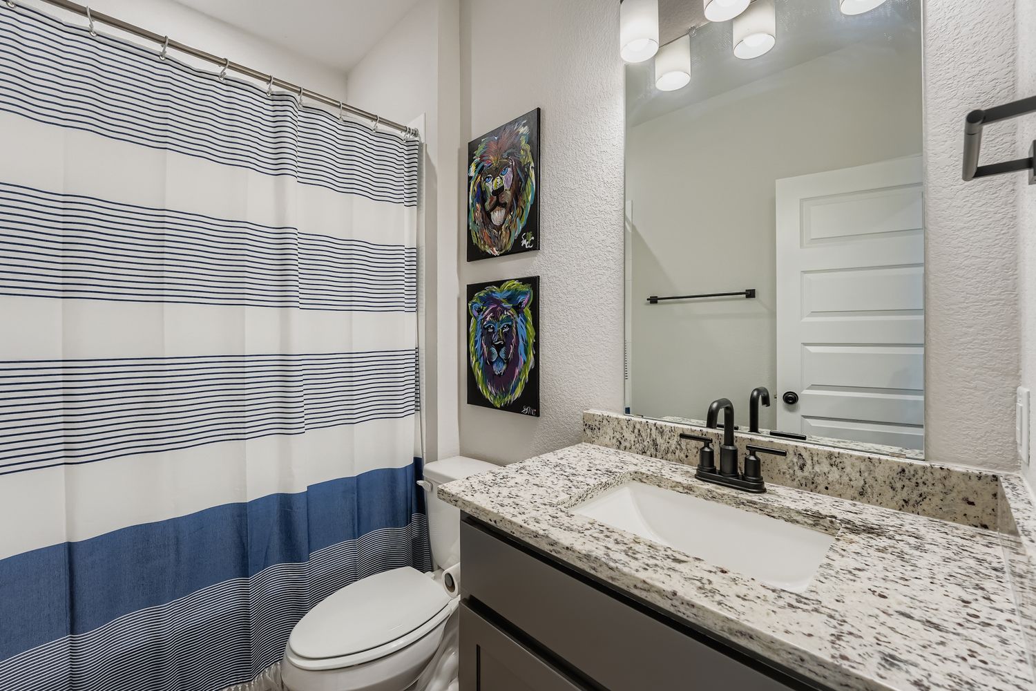 148 Gullivers Drive Elgin, TX 78621 - Photo 15 of 21 a bathroom with a granite countertop sink toilet mirror and shower