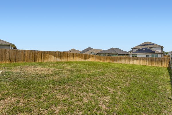 148 Gullivers Drive Elgin, TX 78621 - Photo 18 of 21 a view of a lake with a big yard