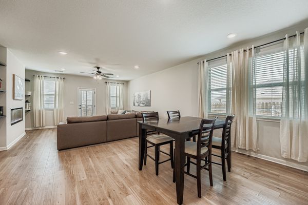 148 Gullivers Drive Elgin, TX 78621 - Photo 7 of 21 a large kitchen with dining table and chairs