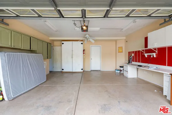 a view of a room with wooden floor and windows