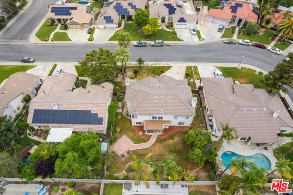 an aerial view of residential houses with outdoor space