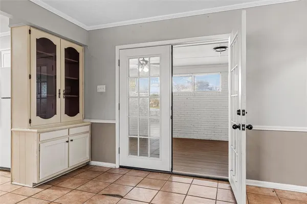 a spacious bathroom with a shower and a mirror