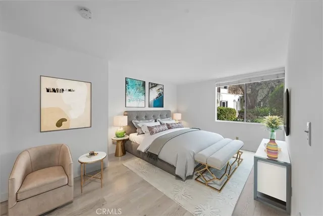 a bedroom with a bed and a couch