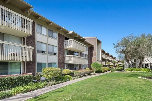 a front view of a building with garden