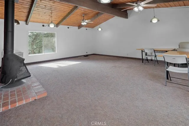 a view of a livingroom with furniture and a ceiling fan