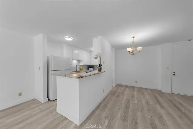 a view of kitchen with wooden floor