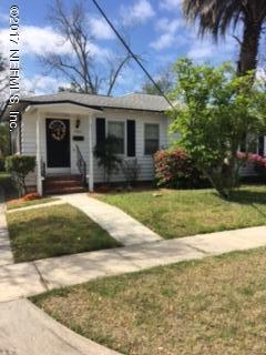 4724 Dundee Road Jacksonville, FL 32210 - Photo 1 of 16 a front view of a house with a yard and potted plants