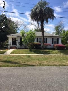 4724 Dundee Road Jacksonville, FL 32210 - Photo 3 of 16 a front view of house with yard and trees around