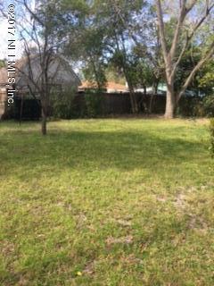 4724 Dundee Road Jacksonville, FL 32210 - Photo 5 of 16 a view of a yard with a house