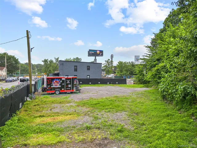 a view of a house with swimming pool and sitting area