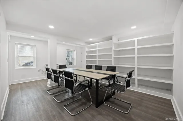 a living room with furniture a wooden floor and a window