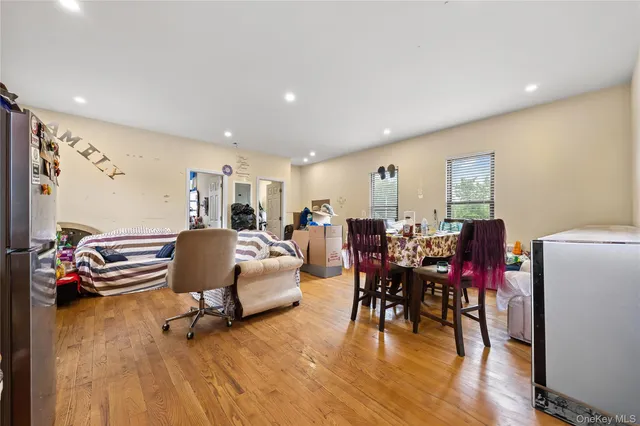 a living room with lots of furniture and kitchen view