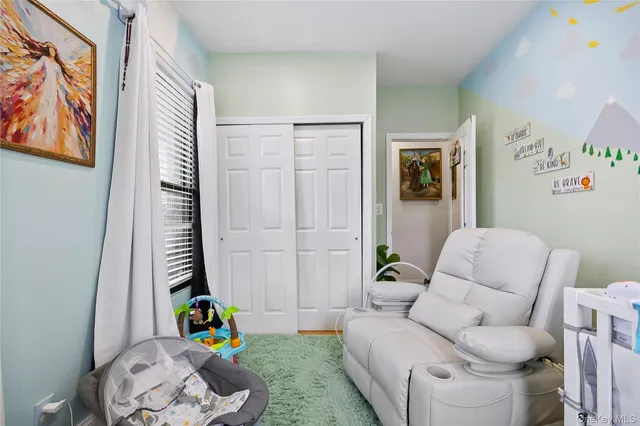 a kitchen with refrigerator and microwave