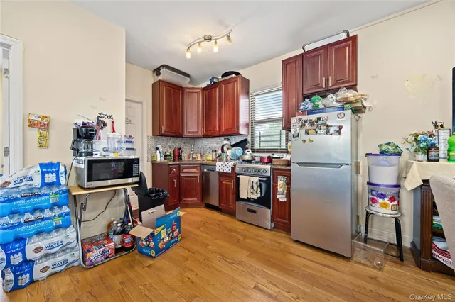 a living room with furniture a rug and a flat screen tv