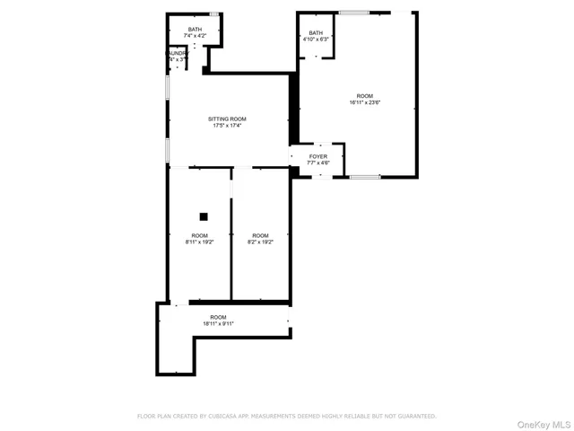 a picture of a bench in front of a wall