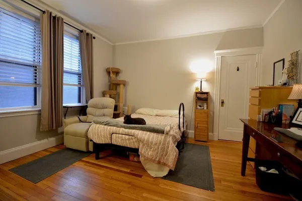 a bedroom with furniture and a window