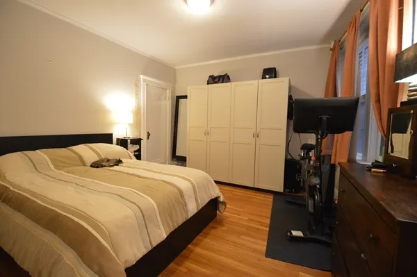 a bedroom with a bed and a walk in closet