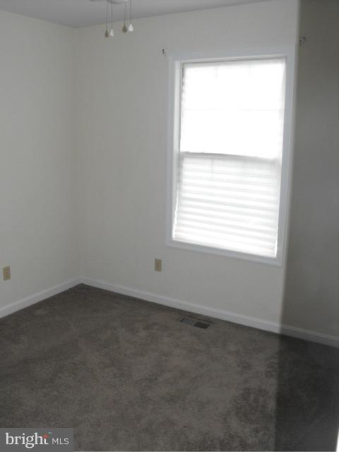 145 Cove Point Road Lusby, MD 20657 - Photo 11 of 13 an empty room with a window