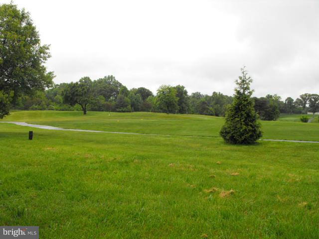 145 Cove Point Road Lusby, MD 20657 - Photo 13 of 13 a view of a grassy field with trees